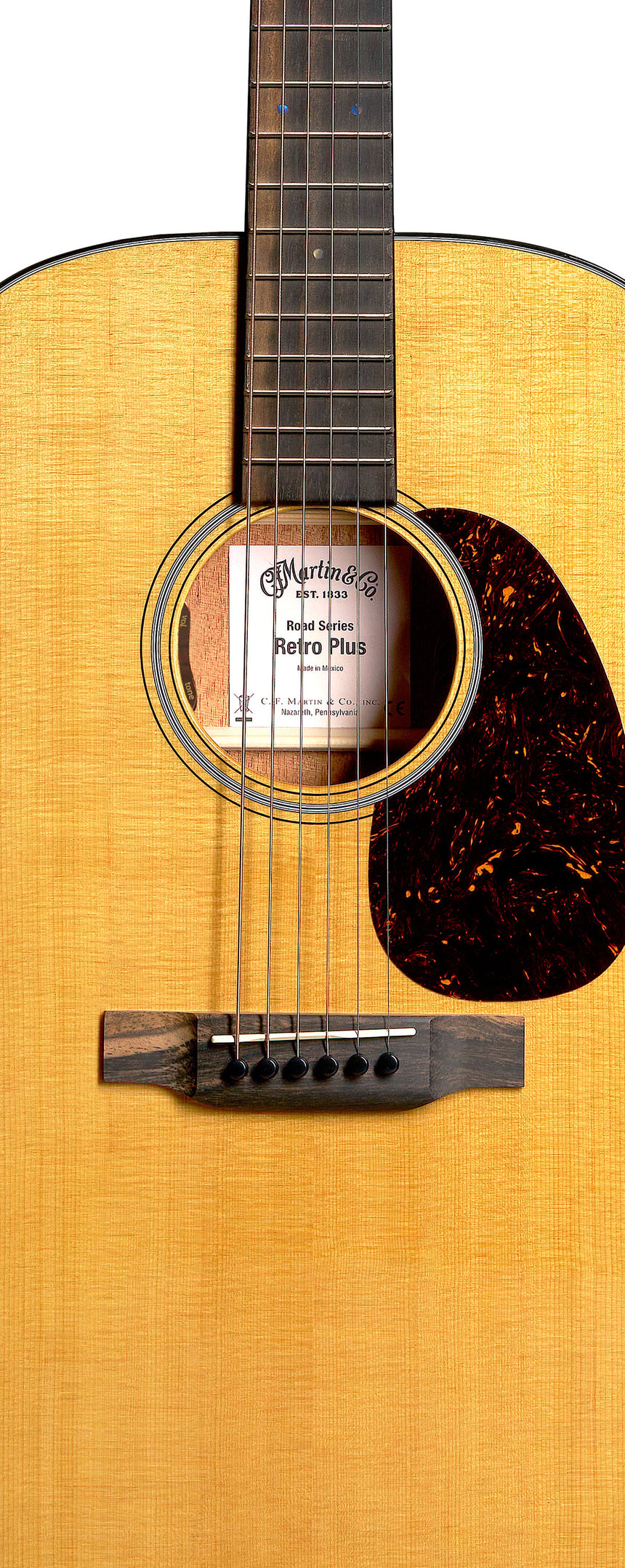 Martin DE-RM Retro Mahogany acoustic guitar with natural Aging Toner finish – detail of the top and soundhole.