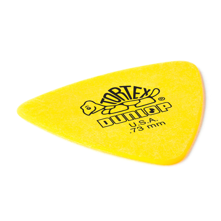 Angled close-up of a yellow 0.73 mm Dunlop Tortex Triangle pick from the Player’s Pack