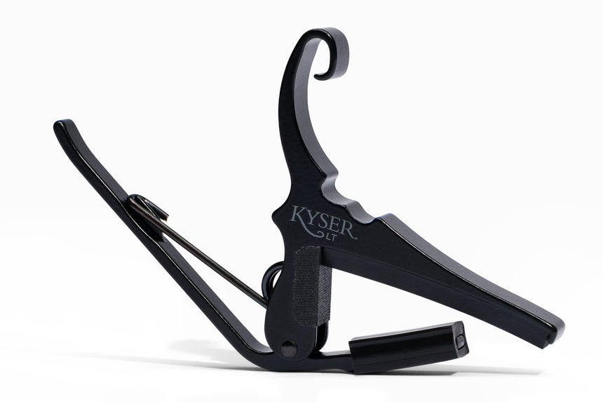 Black Kyser KG6LTA low-tension acoustic guitar capo – front view on white.